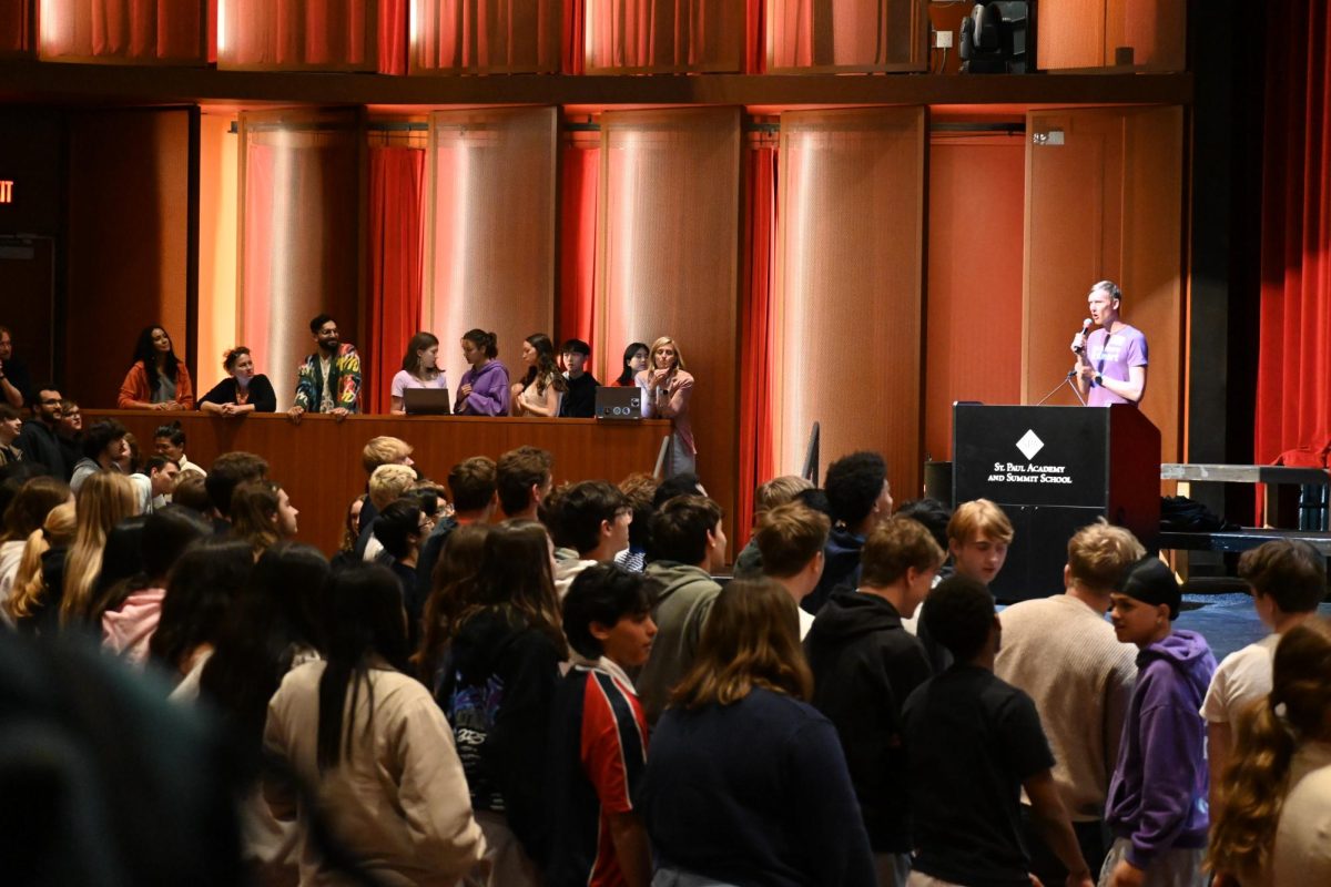 STAND UP.Students and faculty in Huss stand to express that they believe the statement given by the speaker is true. Those who believed it was false remained seated. 
