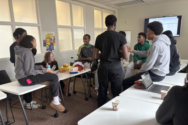 UNITED. Black Student Alliance members chat and eat snacks in the East Conference Room in the library. Junior Boki Mullataa, “I joined BSU to participate in an environment [where] I was welcomed in and […] where a lot of people share some of the same experiences.”