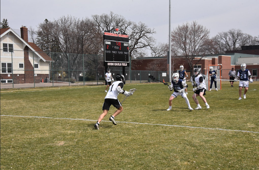 CHARGE FORWARD Captain Henry Hartlyn charges towards the defense of Proctor’s team. This offensive approach does not win the Hawks a goal, but leads to a face-off where the Hawks grab the advantage.