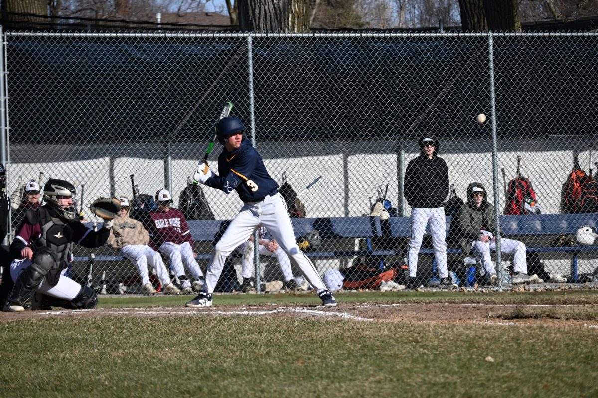 UP TO BAT. Sophomore Charlie Zakaib eyes the ball as it comes at him at full speed.
