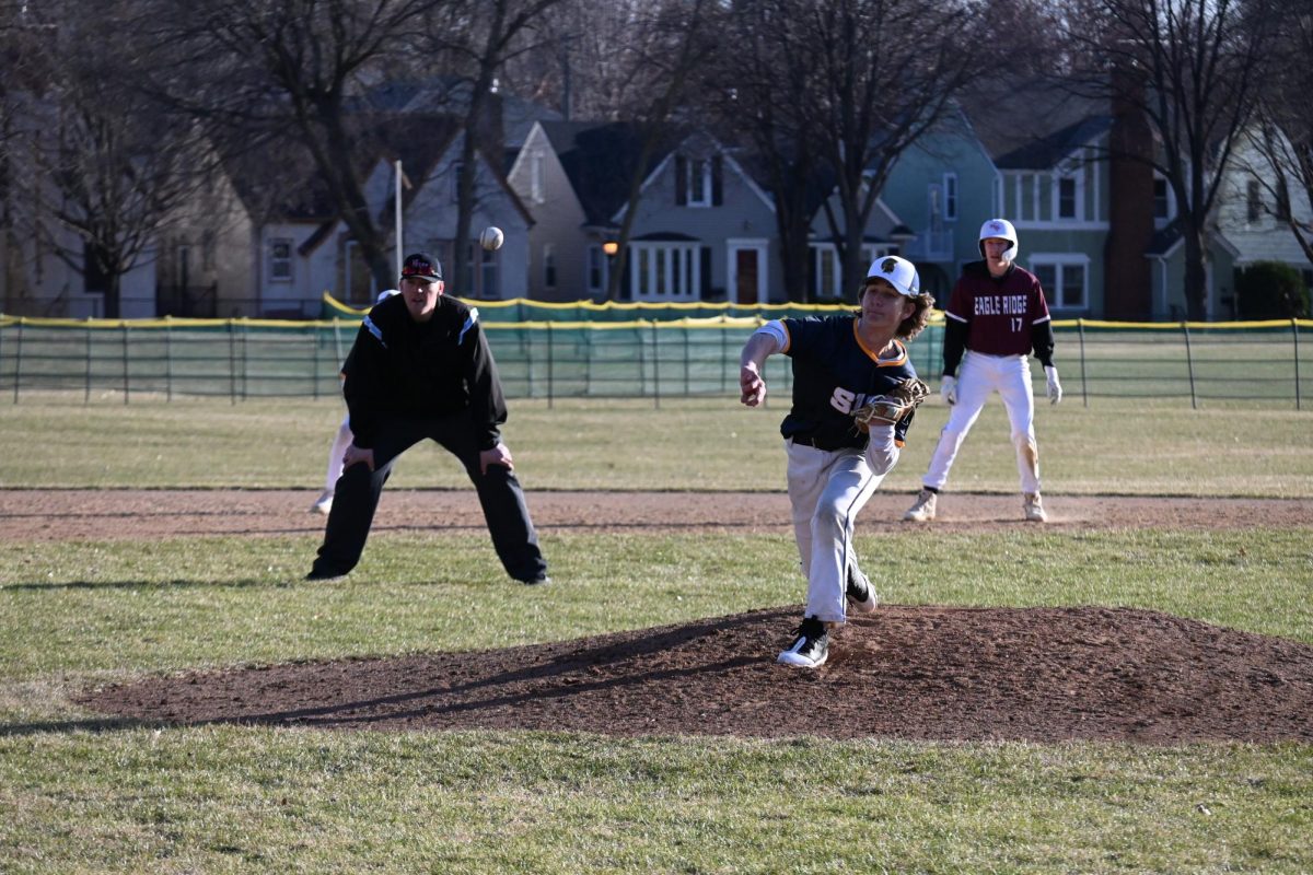 GREAT FORM. Sophomore Gus Hembre flicks his wrist to deliver a perfect pitch.