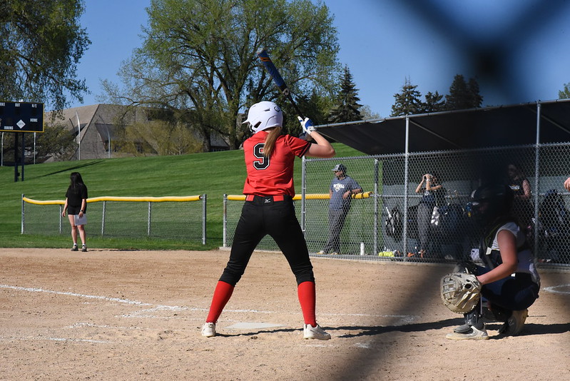 Jay Tilton appears again at the first of her two at-bats in the second game. She prepared herself to swing hard and run, low-fiving her teammates on the way to the plate.