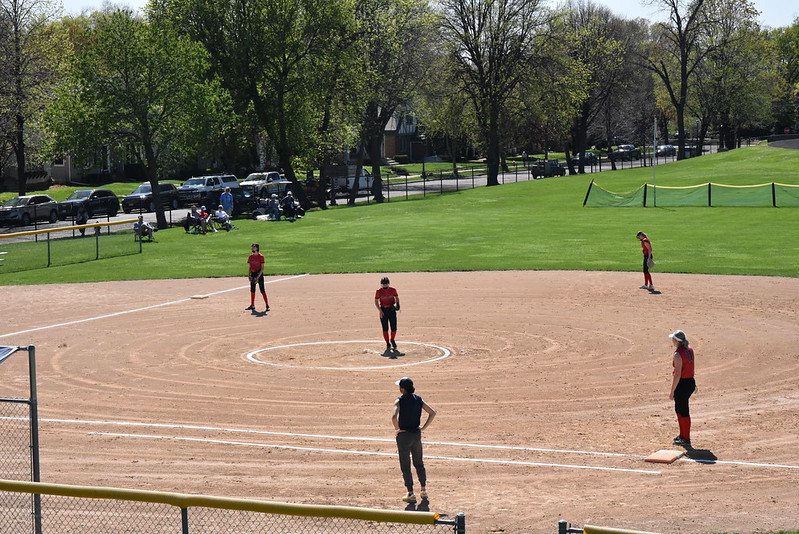 AND NOW, WE WAIT: Redhawks outfielders wait for the Mustangs’ batter to step to the plate. Mustangs’ coach waits in the coaches box as everyone sets into their place. 