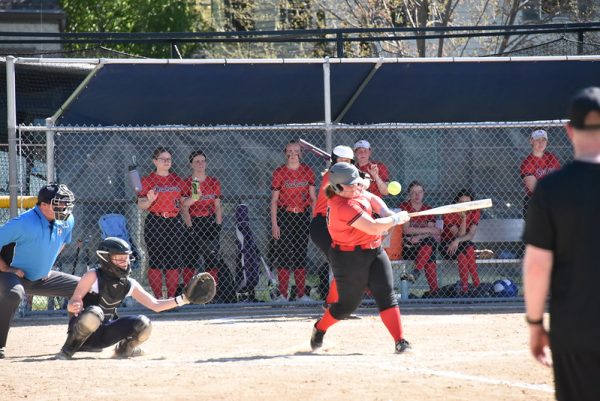READY, STEADY, SWING: Captain Helen Frost went up to bat and swung far. Although she ended up being tagged at first base, she continued to make multiple other impressive swings and defensive plays for the Redhawks.