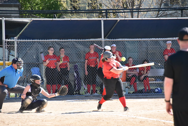 READY, STEADY, SWING: Captain Helen Frost went up to bat and swung far. Although she ended up being tagged at first base, she continued to make multiple other impressive swings and defensive plays for the Redhawks.
