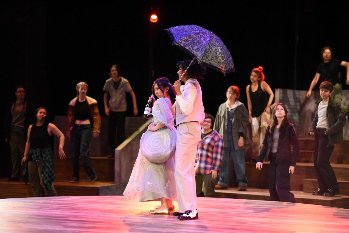 ROAD TO HELL. Before returning to Hadestown, Persephone (Ellie Putaski) is portrayed as an alcoholic who drinks her pain away. 