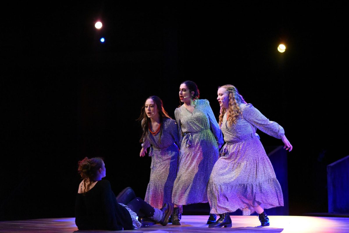WHAT WOULD YOU DO? In "When the Chips are Down," the Fates (left to right: Kate Tuttle, Frances Matthews, and Eva Burns) sing to Eurydice (Maddie Pierce), urging her to choose between betraying Orpheus to benefit herself or remaining on Earth and suffering. 