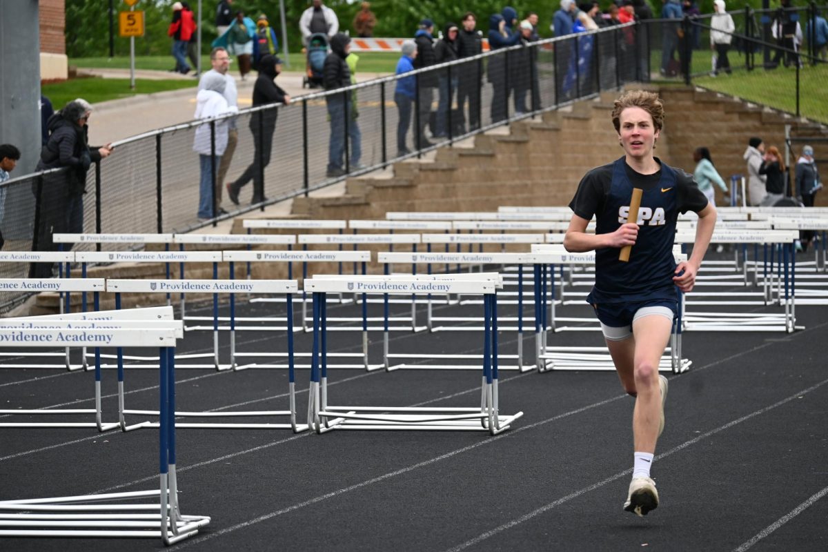 ANCHOR LEG. Ninth-grader Henry Kansas eyes the finish line as the anchor of the 4x800 meter relay.