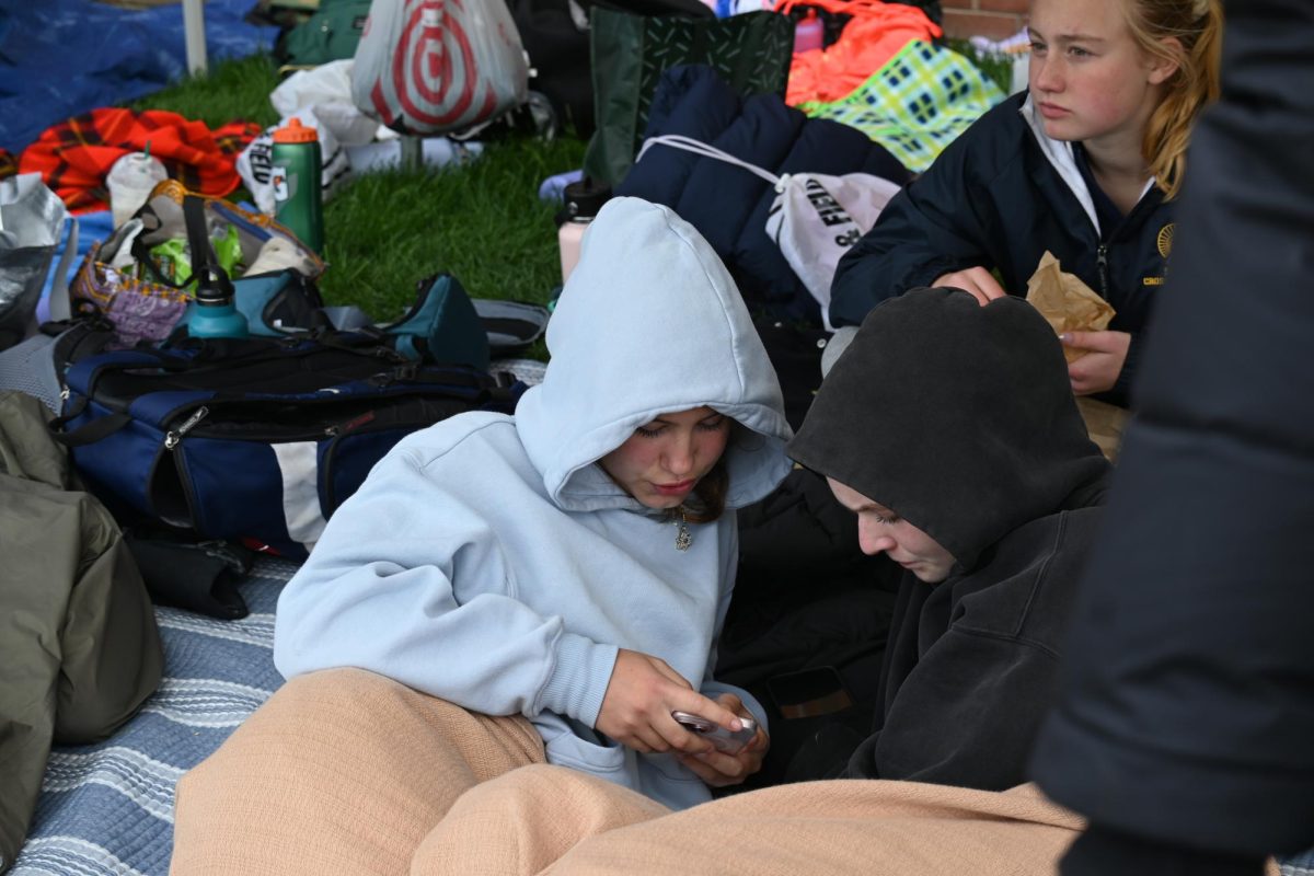 TENT. Athletes rest and socialize in the Spartan tent outside of the track. The tent held many snacks and blankets.