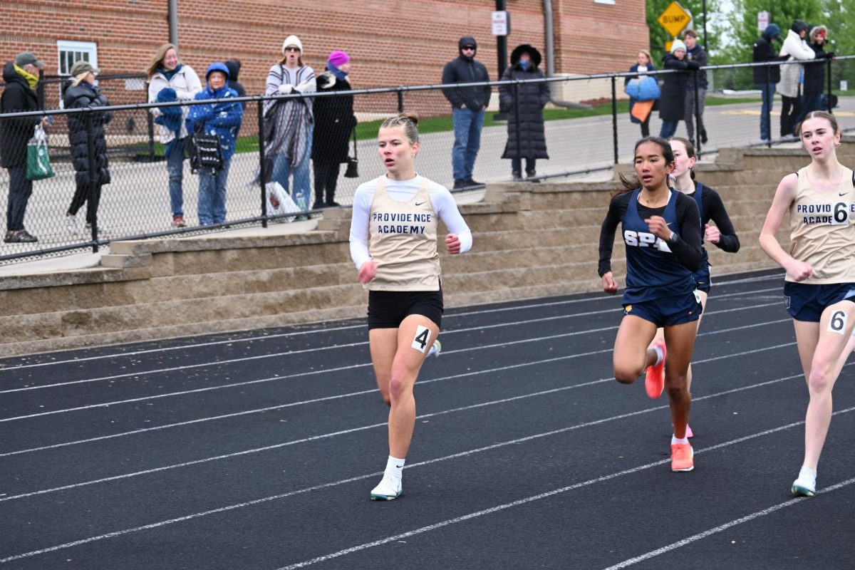 PACK. Sophie Kannapiran and Paloma Good run in a pack during their 800 meter heat.