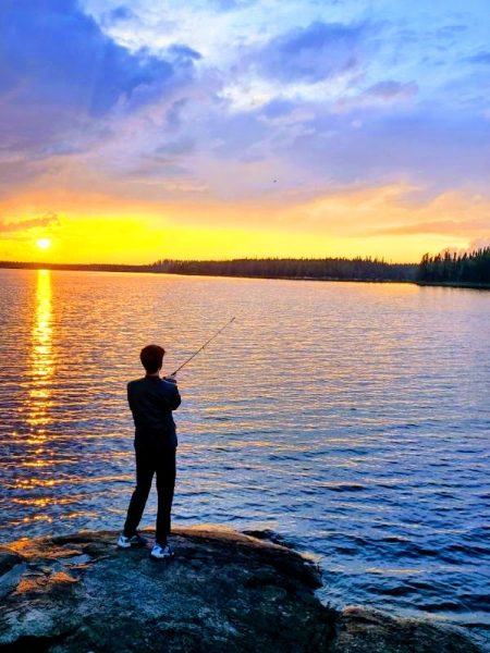 GOLDEN HOUR. Henry is pictured in Canada fishing in the sunrise. 