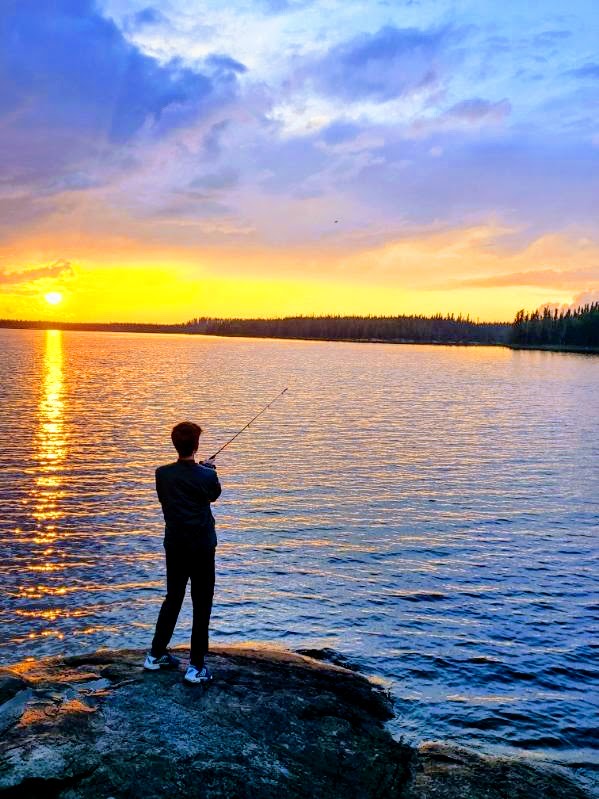 GOLDEN HOUR. Henry is pictured in Canada fishing in the sunrise. 