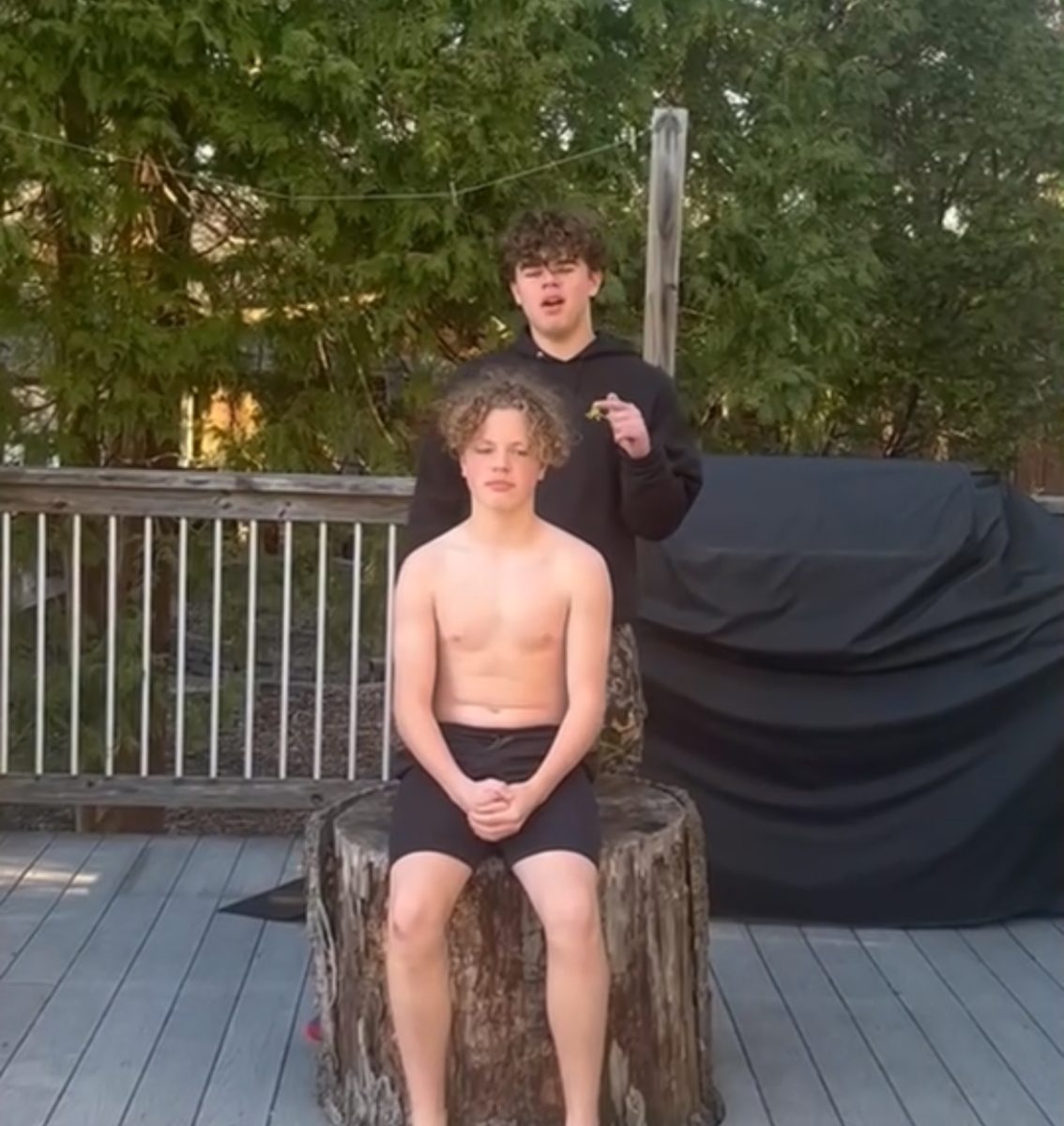Junior Fletcher Coblentz prepares to dump the freezing water onto his younger brothers head.