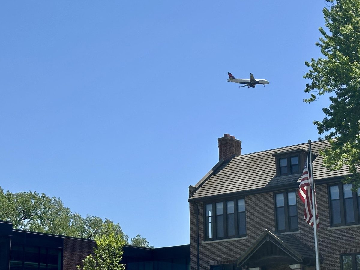 FLY BY. A Delta flight headed to the MSP airport descends on the flight path currently passing over the upper school campus. On Apr. 14, the date this was taken, three planes flew over campus in the 30 minute lunch block.