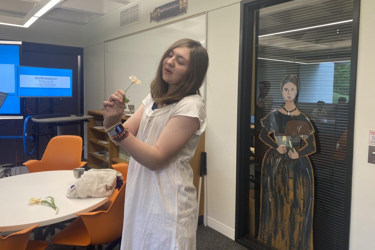 OBLIVIOUS OPHELIA. Sophomore Ella Barlow acts out Act Four, Scene Five of Hamlet with her groupmates.