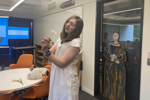 OBLIVIOUS OPHELIA. Sophomore Ella Barlow acts out Act Four, Scene Five of Hamlet with her groupmates.