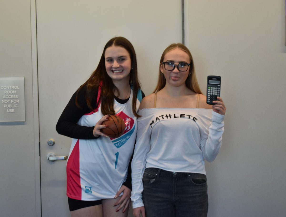 BRAINS & GAINS. Sophomores Jay Tilton and Naomi Mann dress as a mathlete and an athlete. Tilten explains that one of the reasons they picked these costumes is because "Naomi has a broken foot so it's kind of ironic that she's dressed as an athlete".