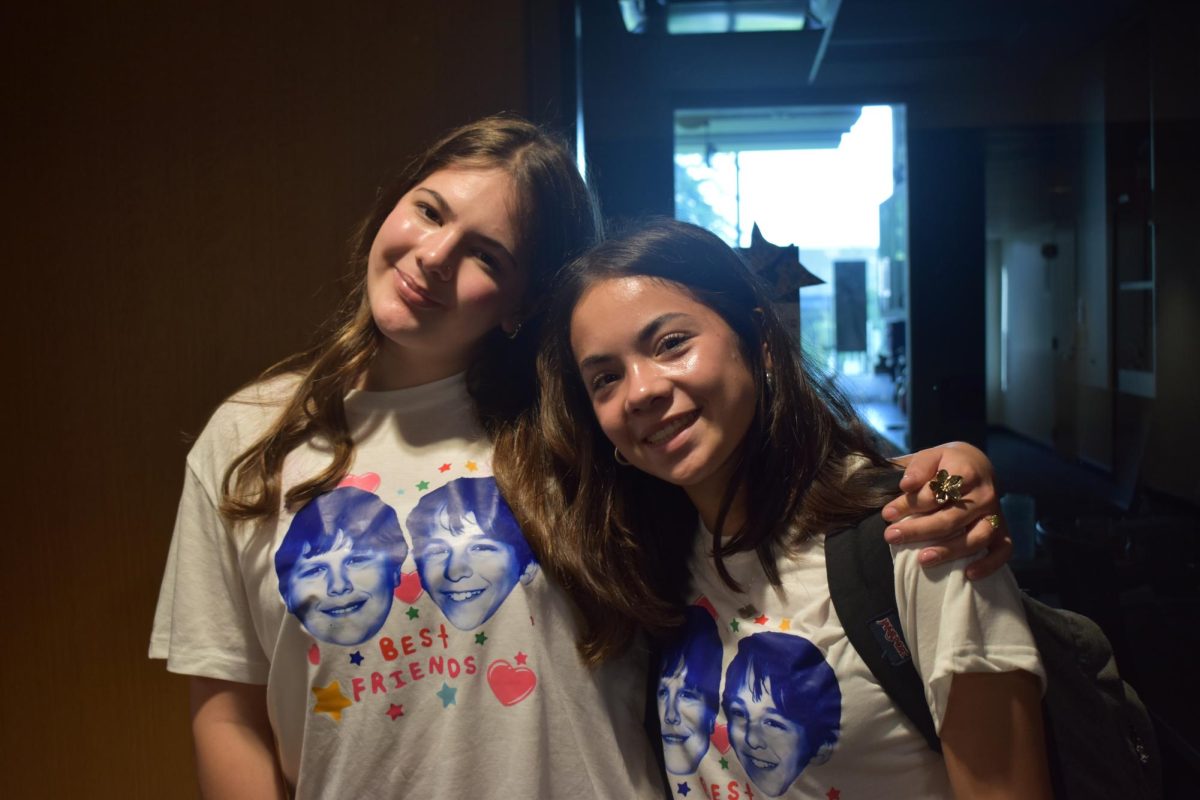 BEST FRIENDS. Sophomores Mae Lachance and Iris Bergad display their shirts which feature Greg Heffley and Rowley Jefferson from Diary of a Wimpy Kid. "I am Greg and Mae is Rowley because when [Mae] was younger and had bangs her sister would tell her she looked like Rowley", Bergad said.
