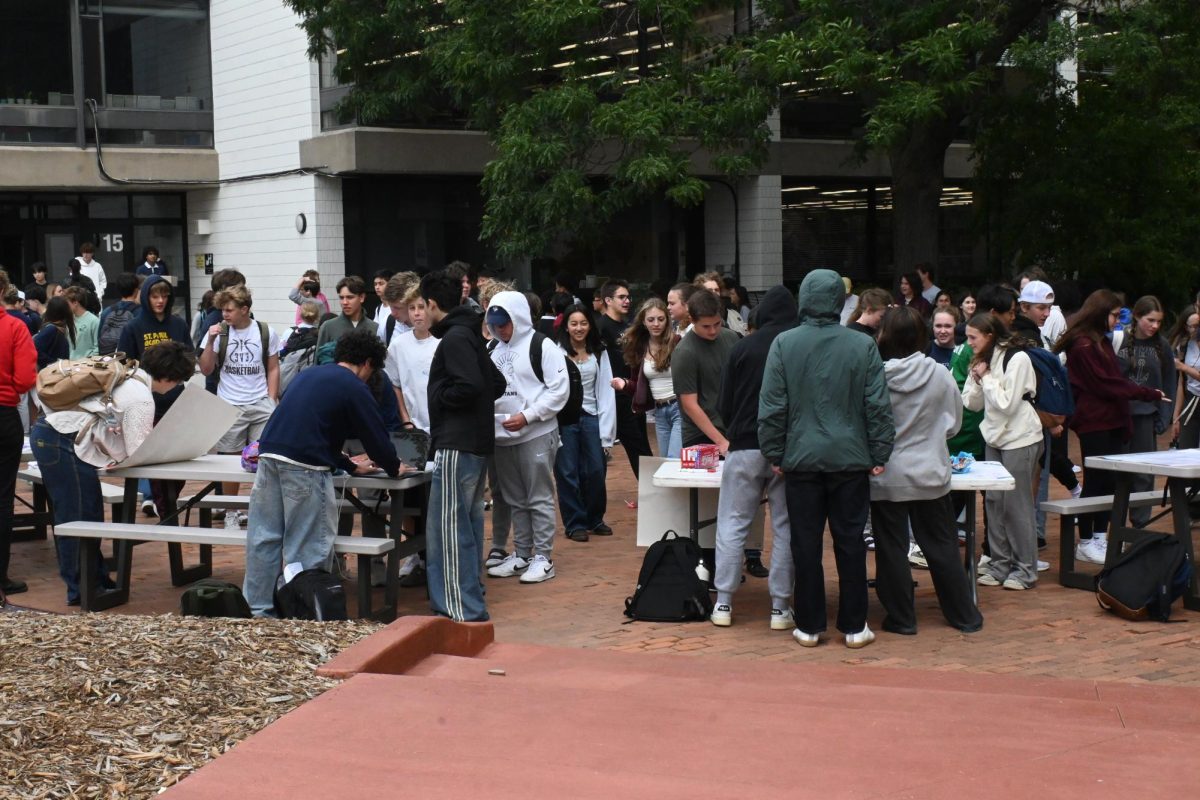CAMPUS BUZZ. Students congregate at the colorful mix of tables, and energy flows in the Lilly Courtyard.