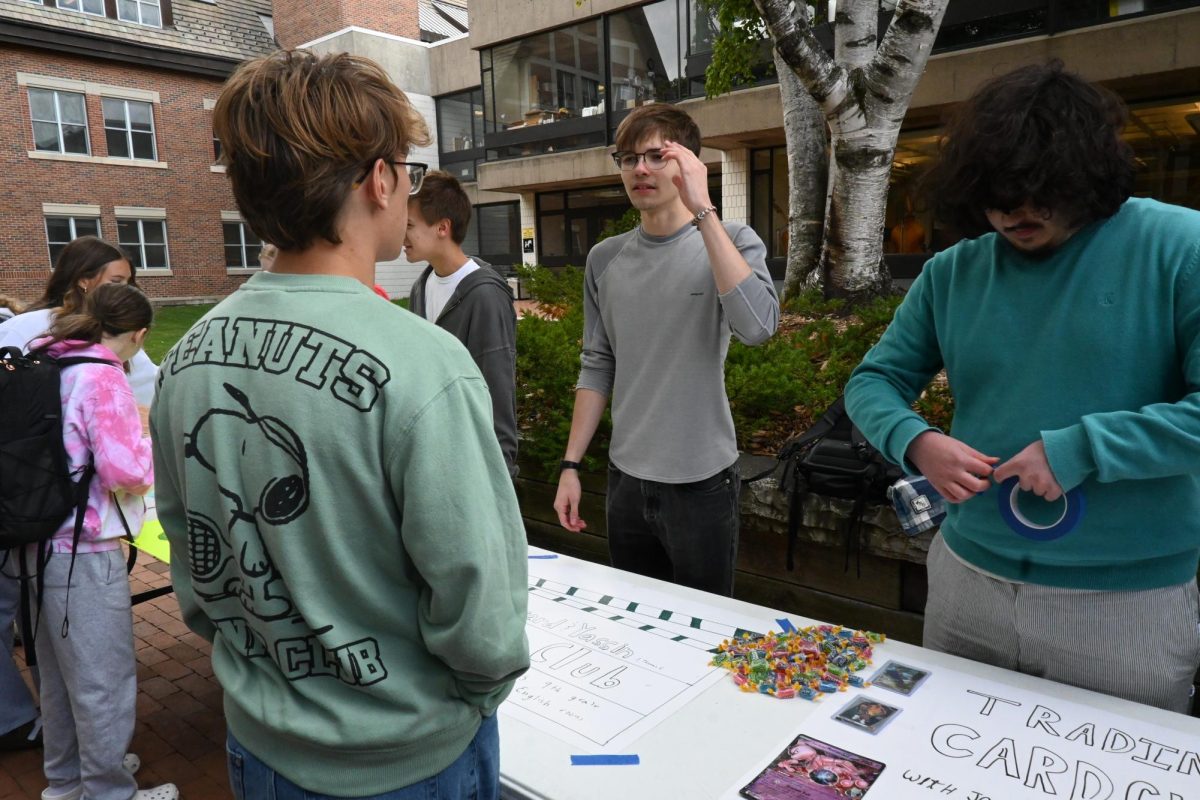 CHECK US OUT. Senior Thomas Ferguson, leader of Film Club, chats with Leo Johnson about his club.