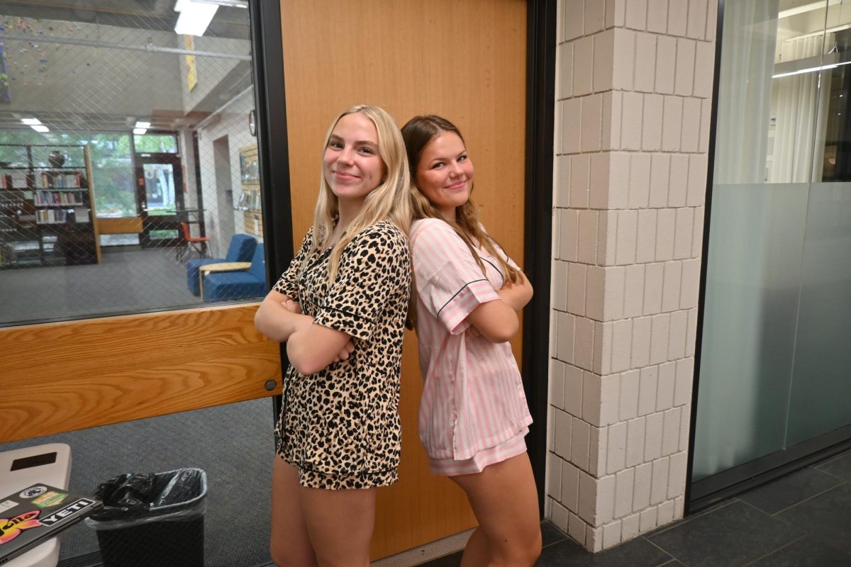 CUTE PJS. Juniors Sophia Johnson and Isla Collins participate in the first homecoming dress up day. "I wanted to wear pajamas and I thought that my set was cute," Collins said.