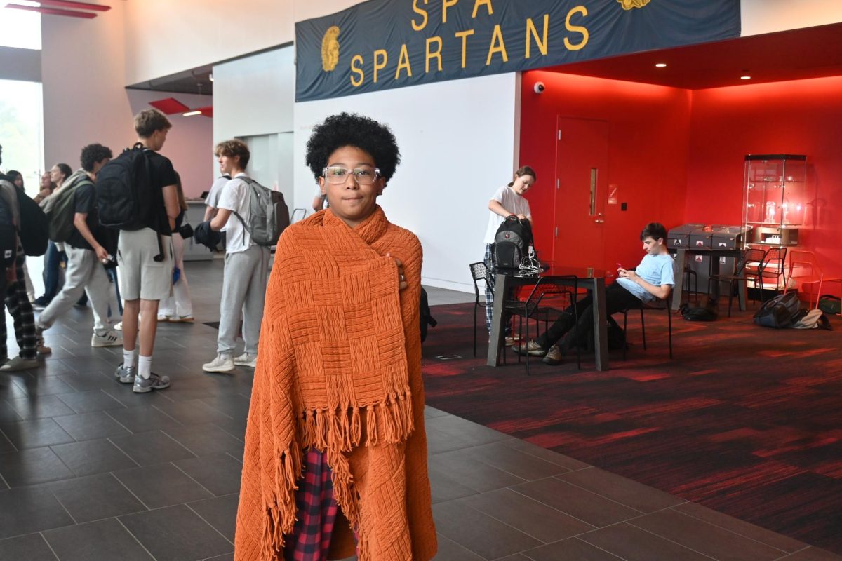 COZY DRESSUP. Freshman Jaiden Abarquez brought a blanket to keep himself warm and toasty. "[My inspiration] for this outfit is I didn't want to be cold," he said.