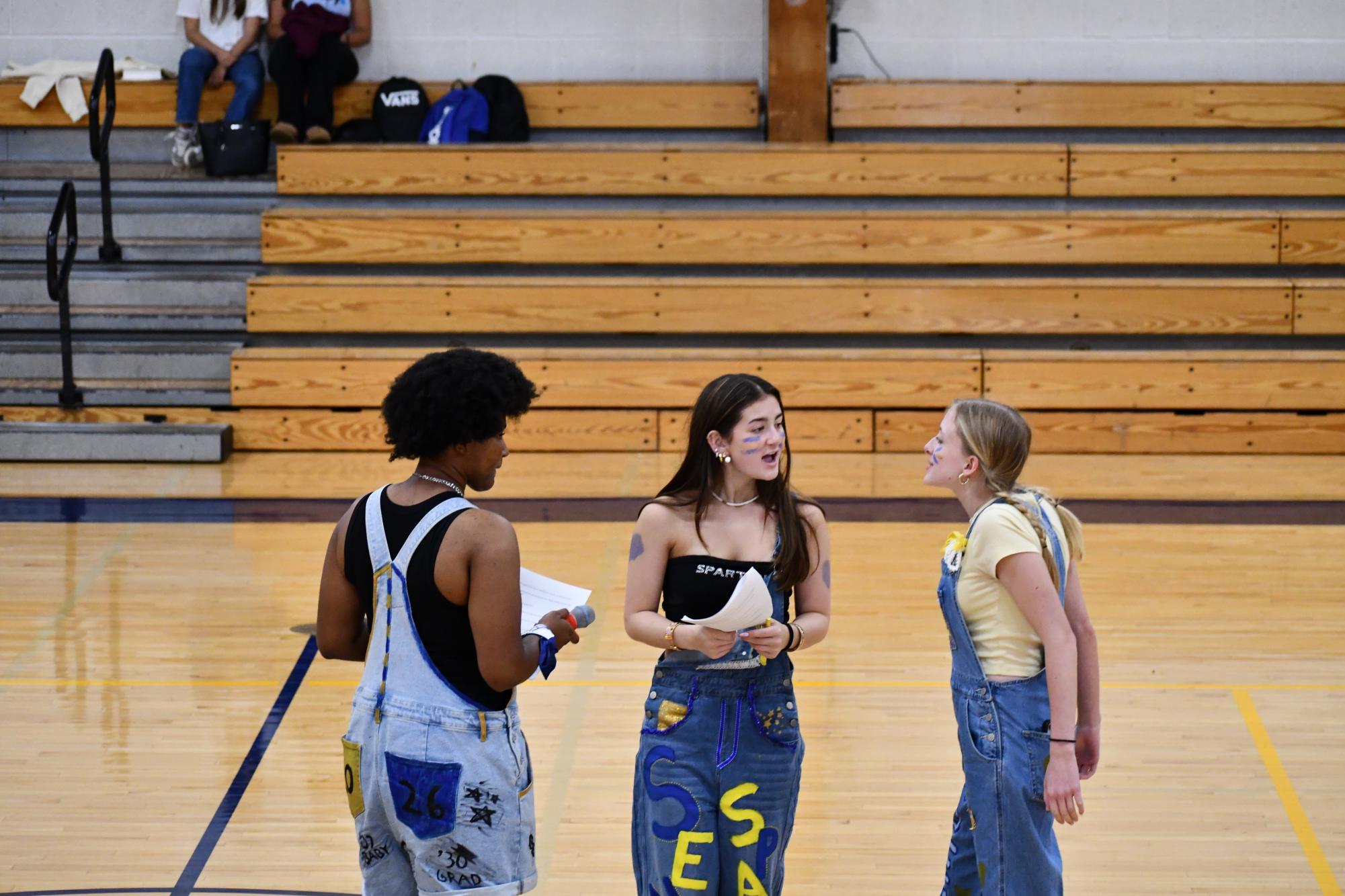 SAC SLAY. Seniors Nijah Johnson, Raina Heidkamp, and Zoe Huelster (left to right) discuss the pep fest. 