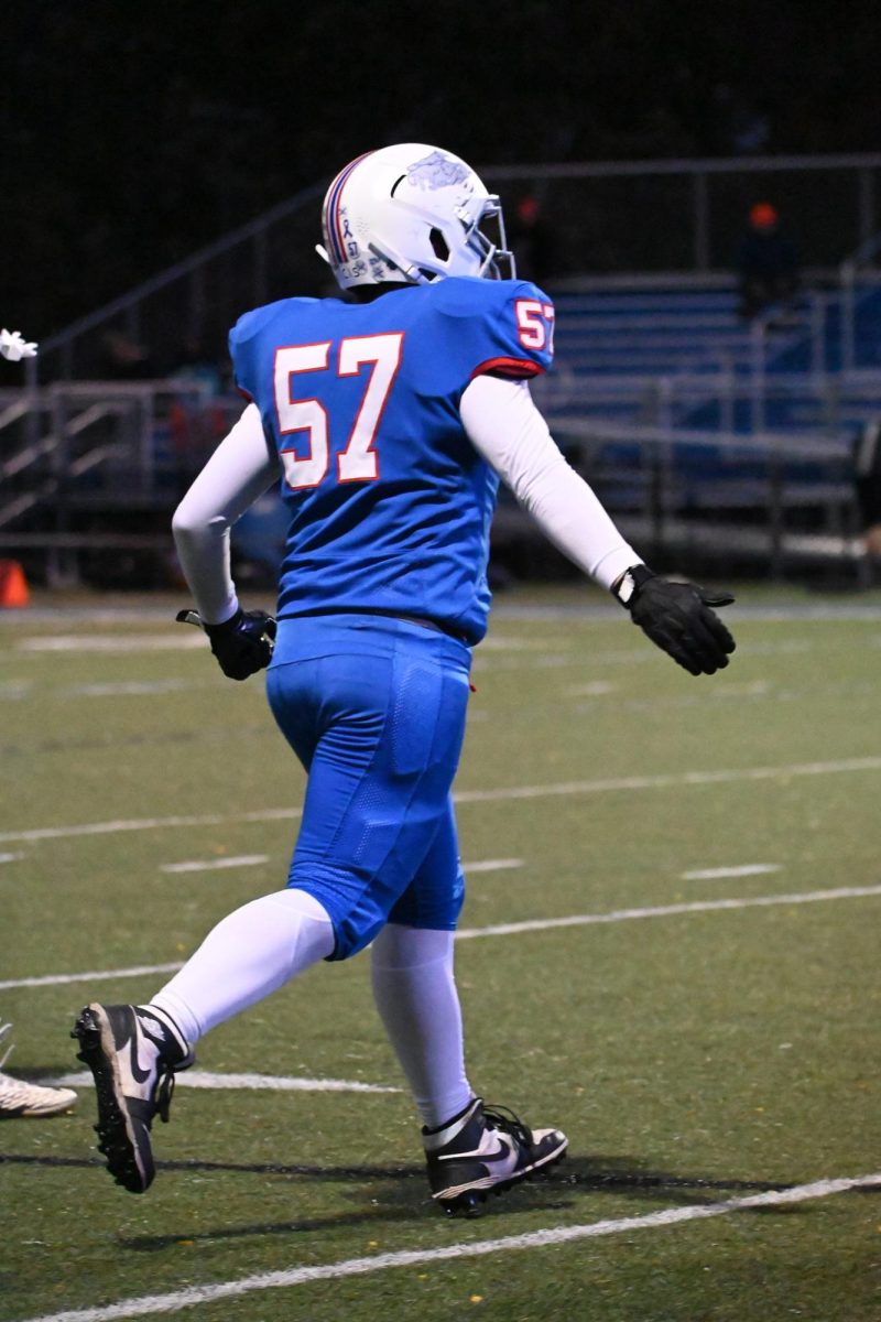 ENTERING THE GAME. Senior Cutler Crook jogs onto the field, looking to make an impact.