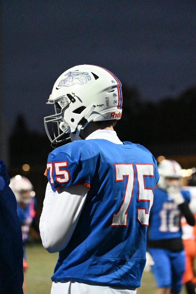 DEEP THOUGHT. Senior Johnny Rog mentally prepares for the section quarterfinal game.