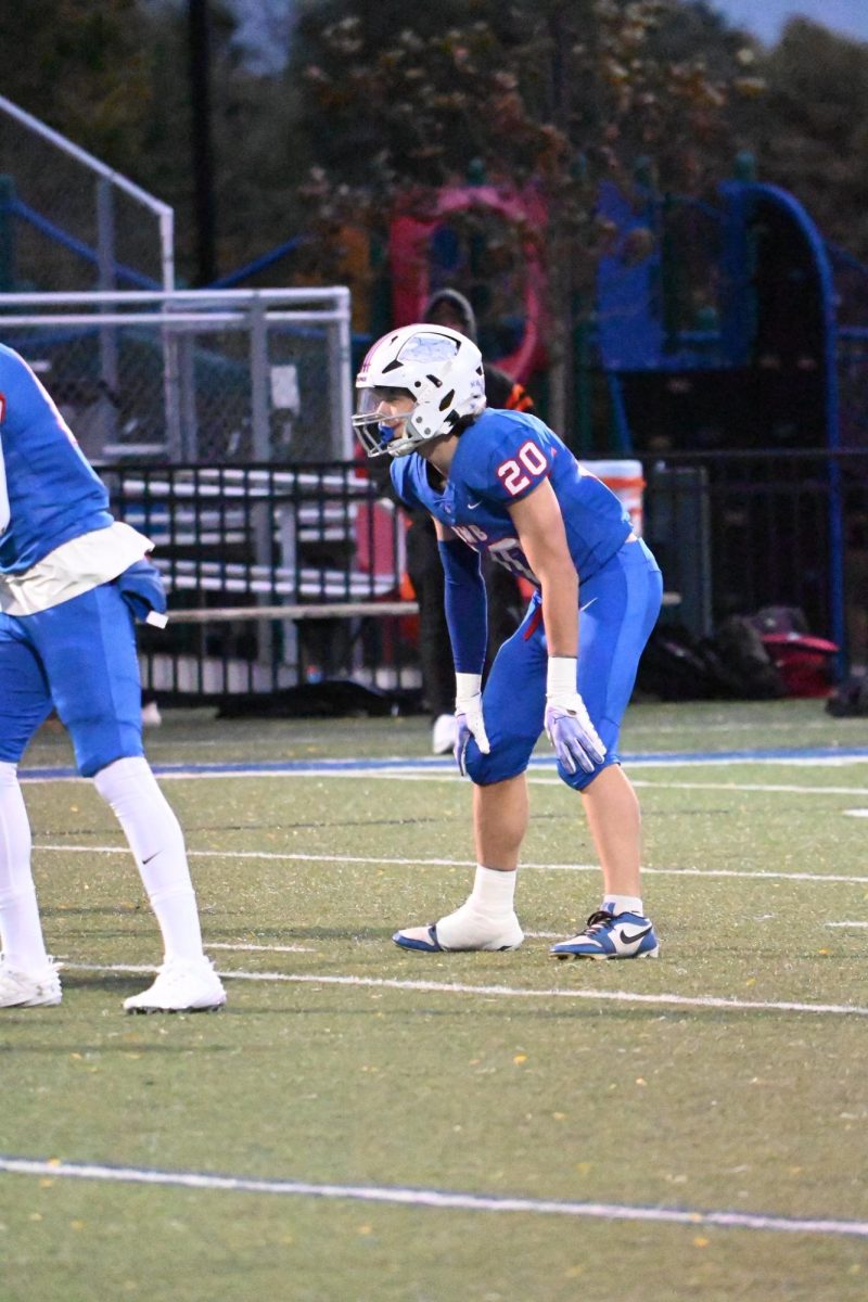 ANITCIPATION. Senior Bennett Sauer put his hands on his knees and gets ready for the play.