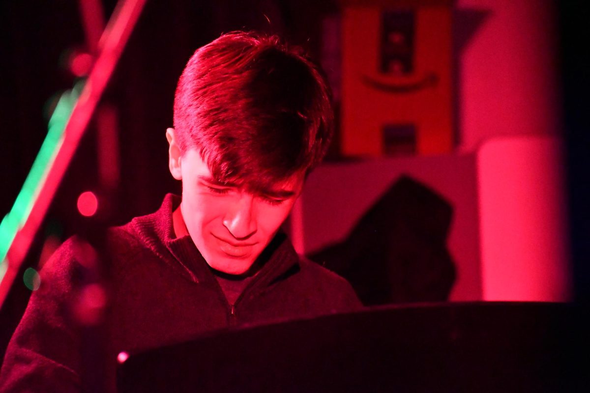 During the Juan Miguel Tribute band's set. senior Roman Farley expressively plays the keyboard.