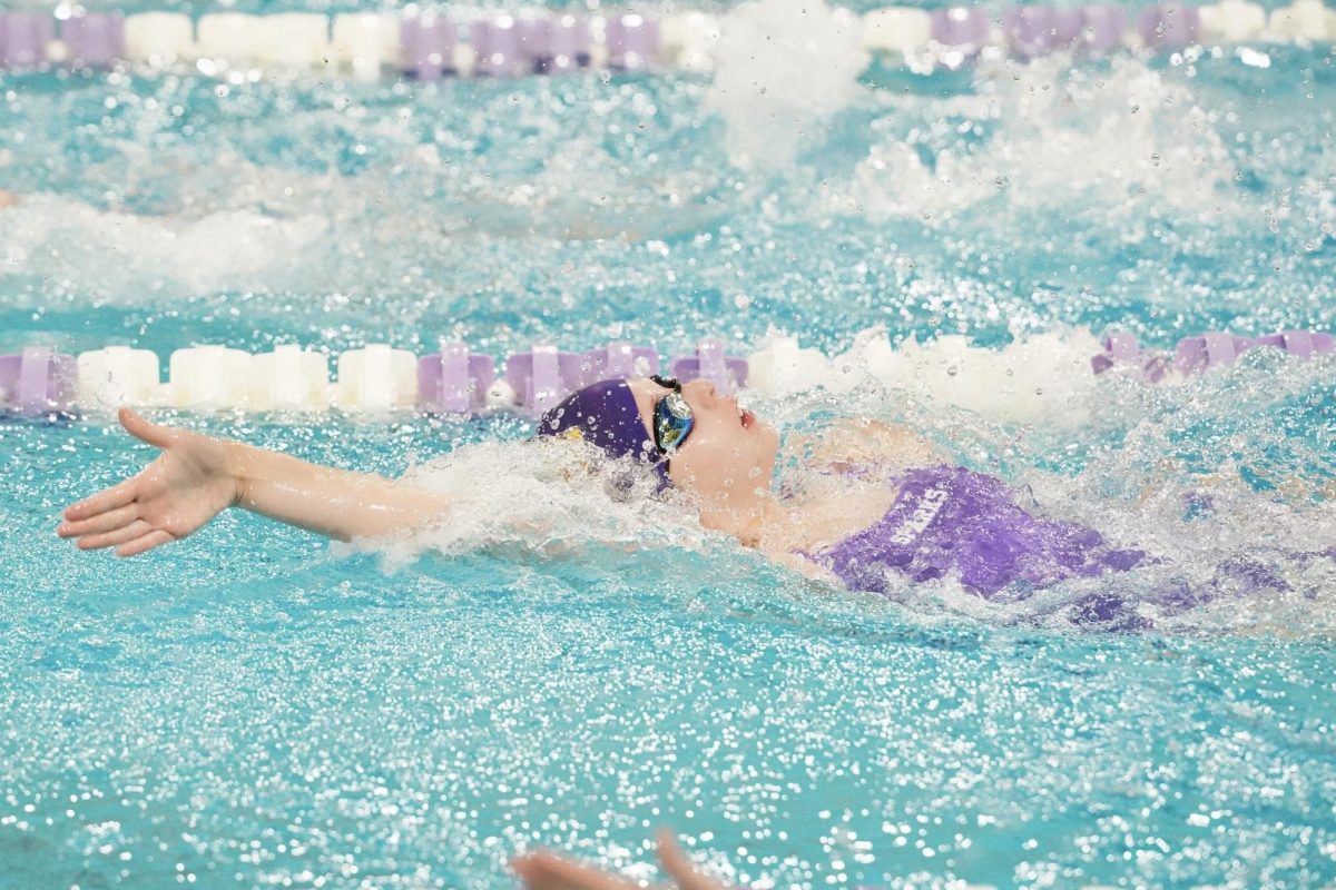 COUNT. Sparks Swimmer counts her strokes whiles she's at the flags in the 100-yard backstroke to know when to flip over for her flip turn.