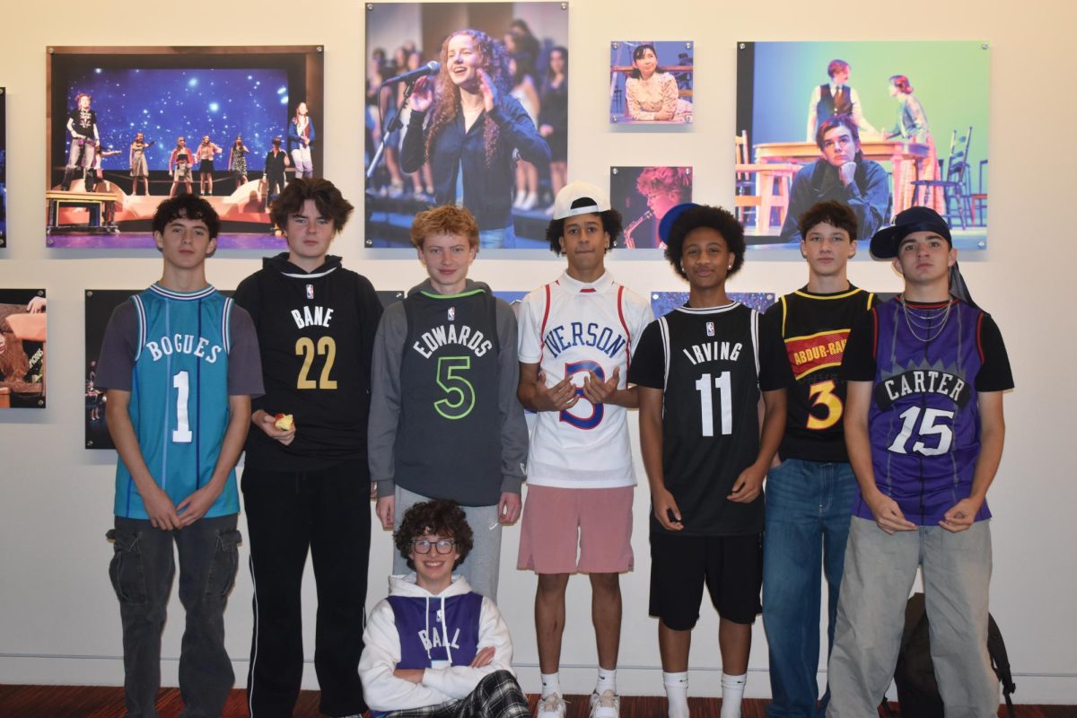 BALLERS. Eight sophomores pose, showing off their backwards basketball jerseys, a recent trend among teenage boys. 