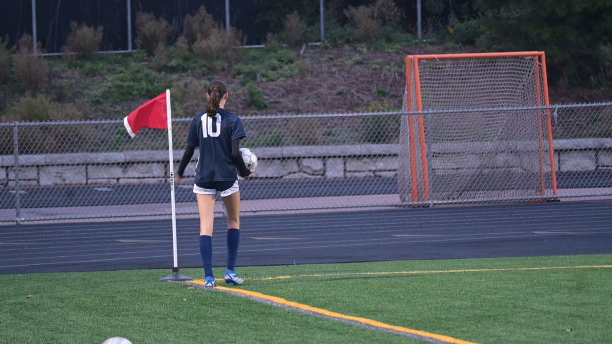 CORNER KICK. Senior Hazel McCarthy lines up for one of the many corner kicks throughout the game.
