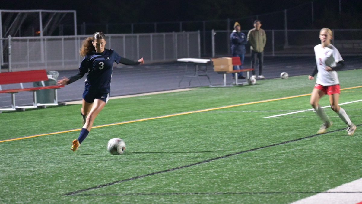 FOURTH STRIKE. Freshman Phoebe Gottlieb chases down the ball, shortly before scoring the fourth goal of the game.