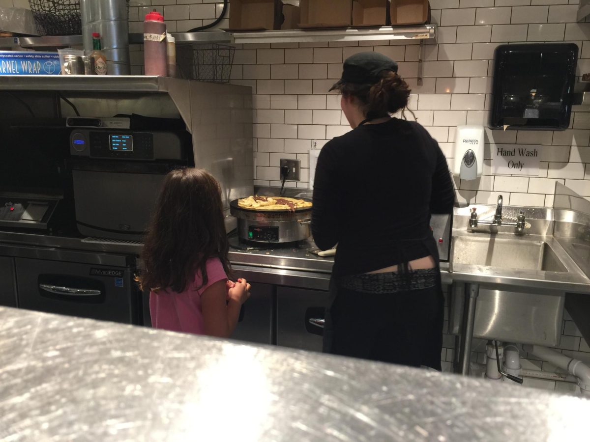 SOUS CHEF. Eight year old Ella Judeh helps her mom prepare a dish in the kitchen. (Submitted by Ella Judeh)
