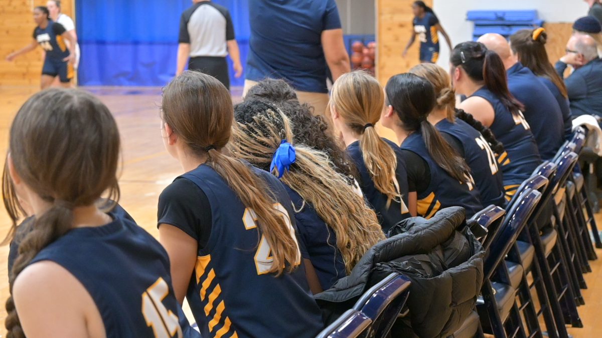 CHEERING. All players cheer for their teammates on the court. Encouragement is the key to success in team sports. 