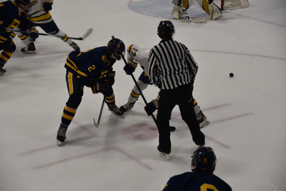 FACE OFF. The Mustangs and the Spartans have a face-off after offside was called on the Mustangs. 