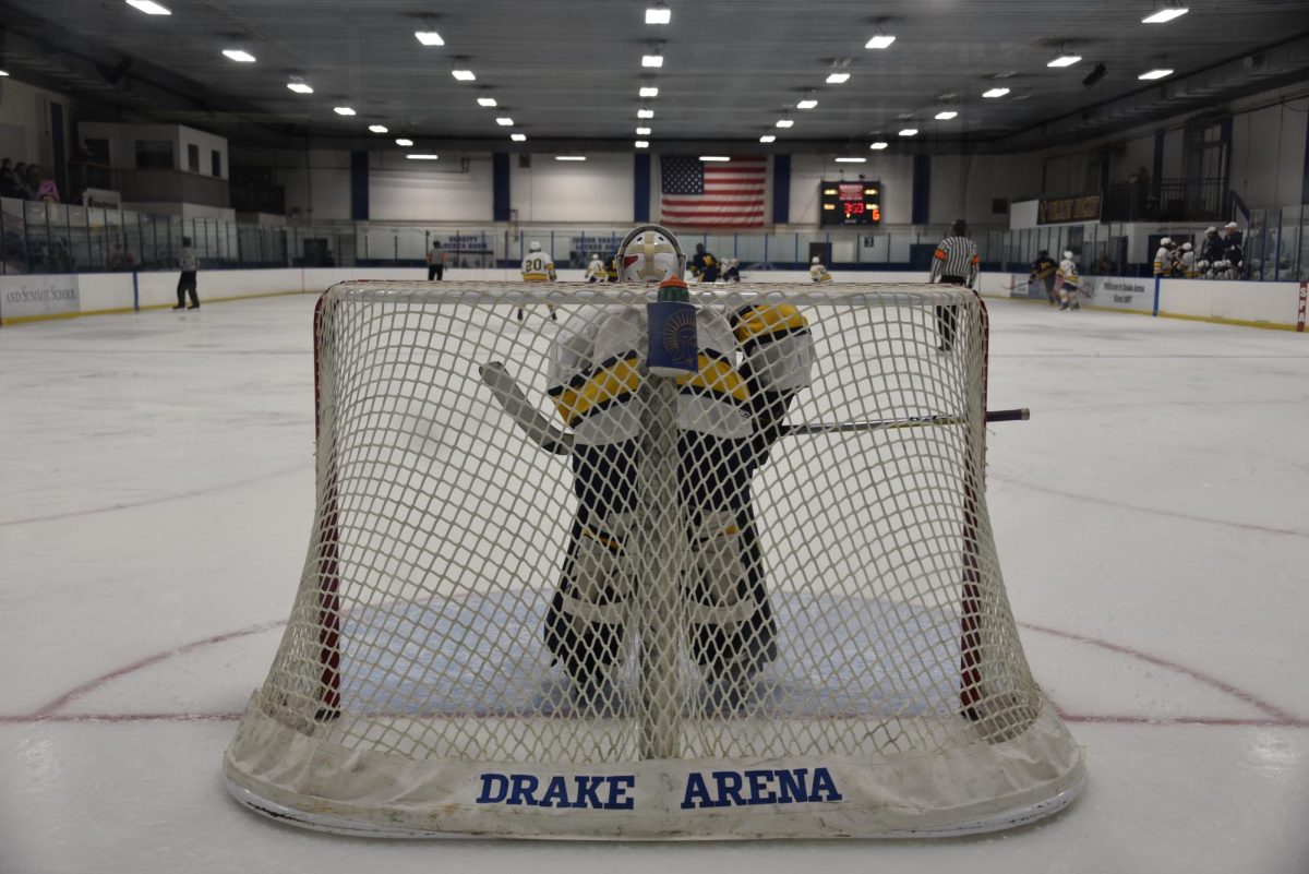 ANALYZE THE ATTACK. Junior goalie Brody Manning watches the game in front of him as the Spartans attack. 
