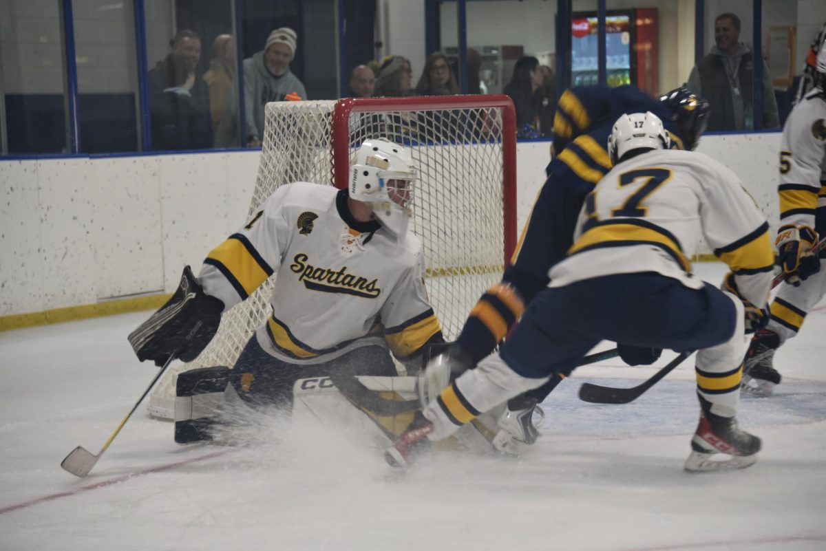 SLIDING SAVE. Goalkeeper Brody Manning slides to save a shot. 