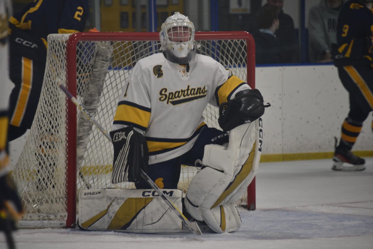 GOALIE GREATNESS. Junior Brody Manning works to save yet another shot for the game. 