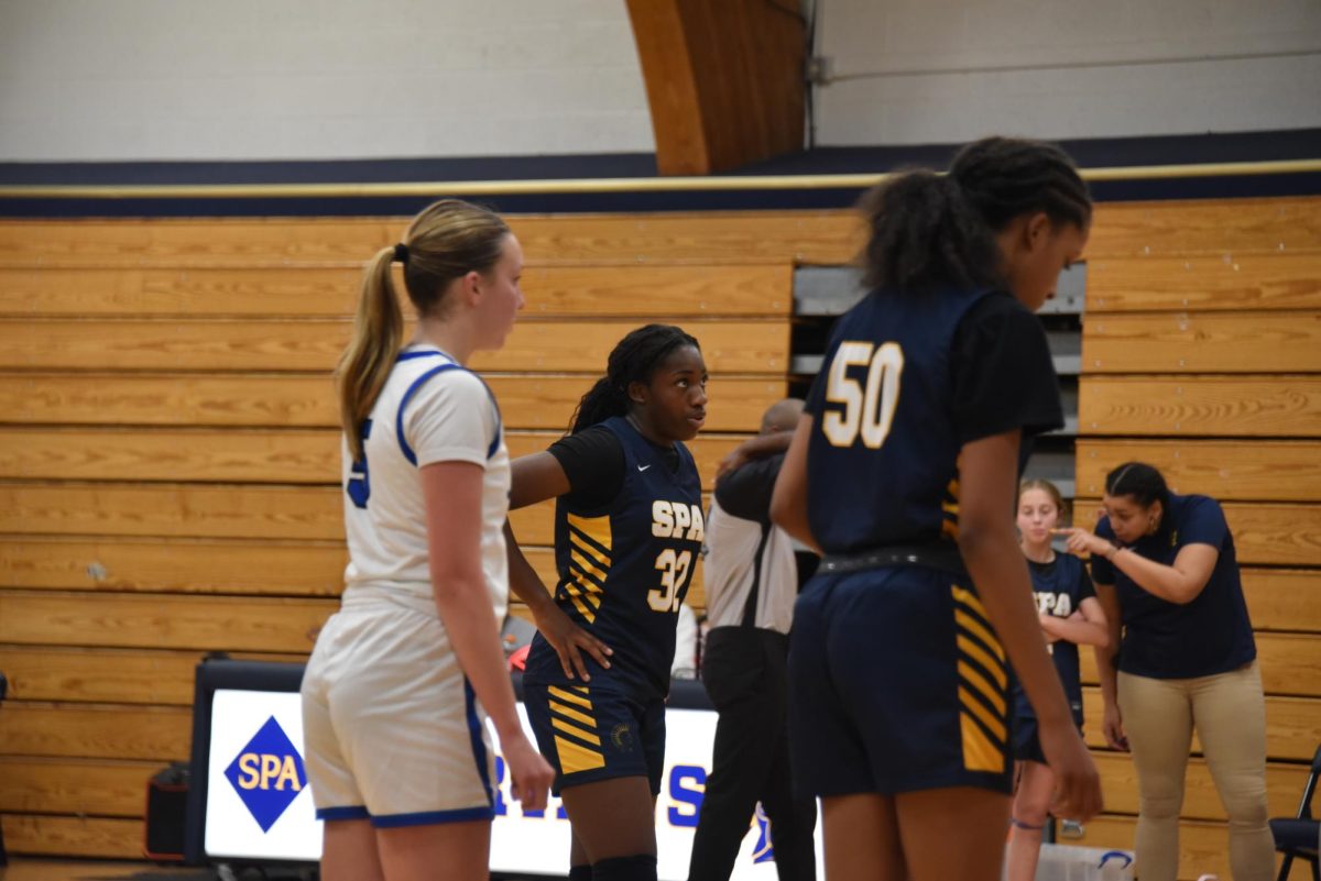 BREATHE. Eighth-grader Amaya Obi-Walker inhales before shooting a free throw. These points were valuable when regaining the lead. 