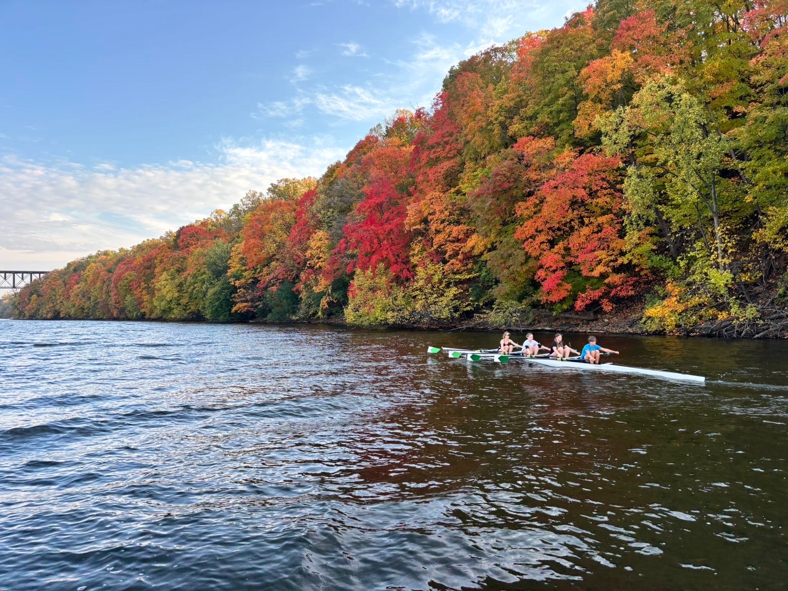 ROW, ROW, ROW YOUR BOAT. Rowers in the Minneapolis Rowing Club work together to compete a 5k race in practice on the Mississippi River.