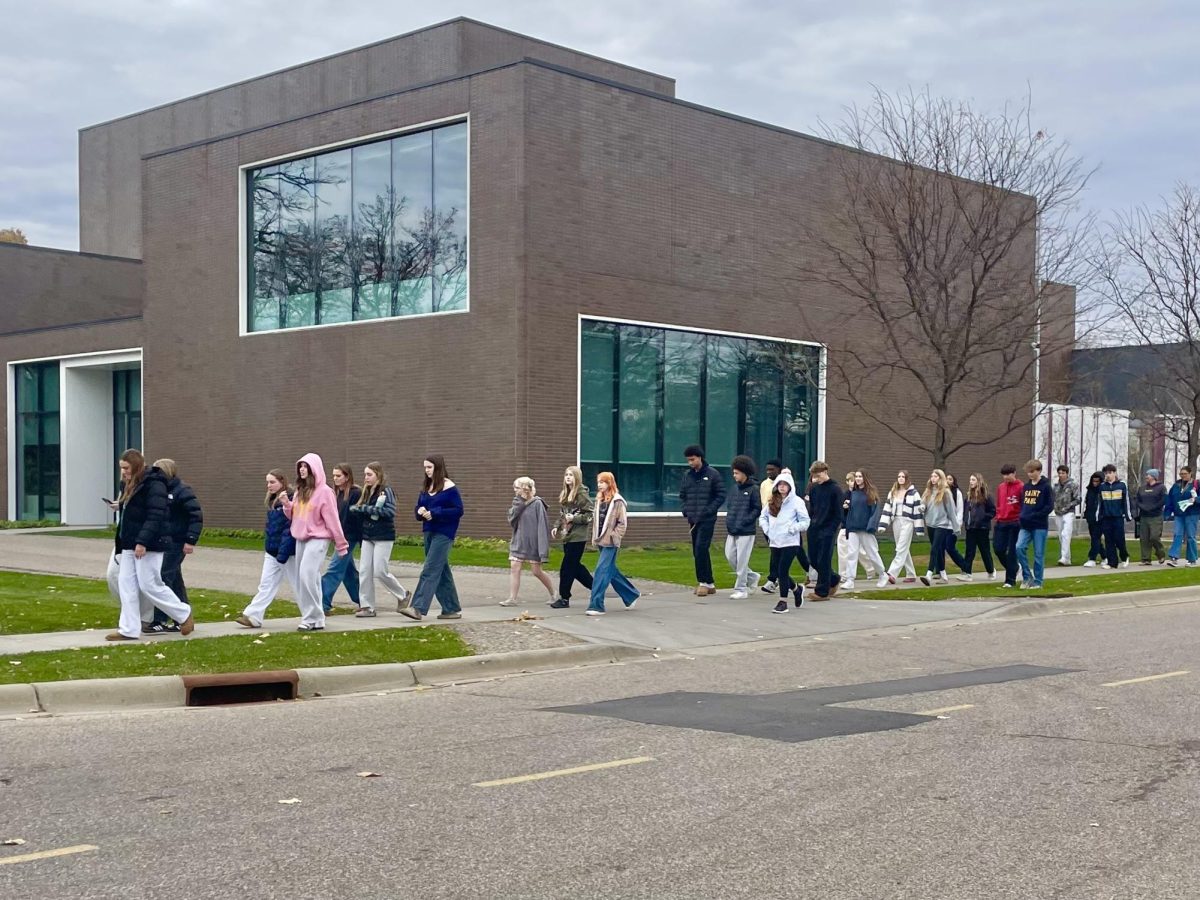WALK OVER. Members of Academy Chorale and some of the Summit Singers made the walk together to the Village. Academy Chorale meets regularly during the school day with nearly 50 students, while Summit Singers rehearse early in the morning on Tuesdays and Thursdays before school begins.