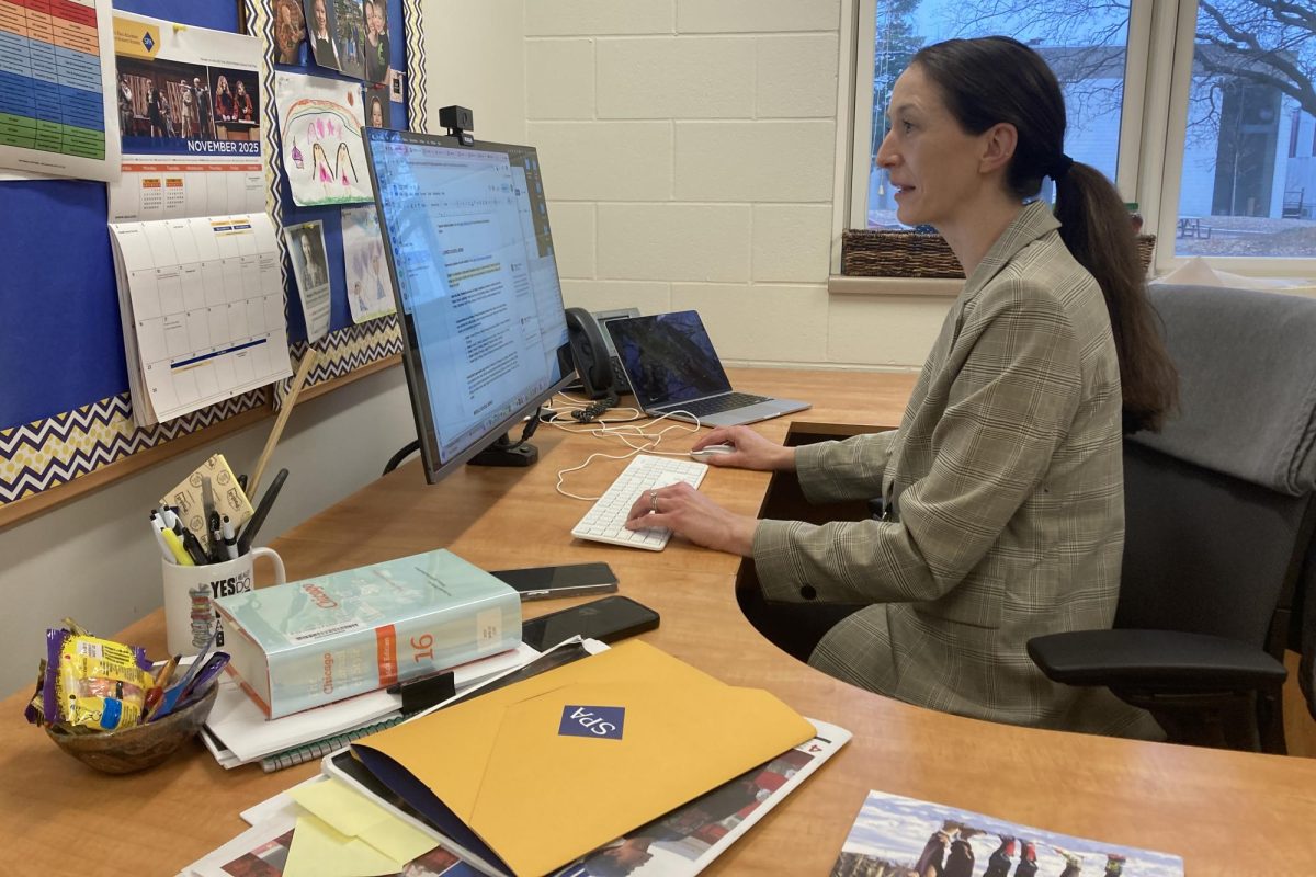 MARKETING MASTER. Director of Communications and Marketing Megan O'Rourke works on preparing magazine content for the school. 