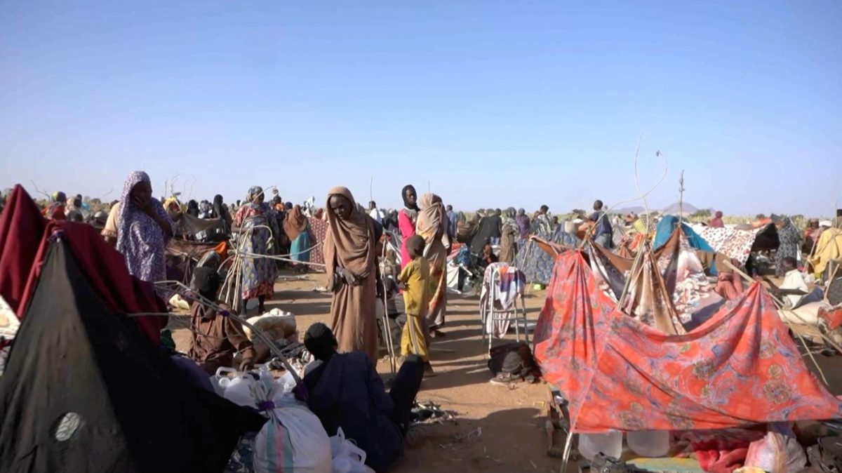 Displaced Sudanese gather and sit in makeshift tents after fleeing Al-Fashir city in Darfur, in Tawila, Sudan, October 29, 2025, in this still image taken from a Reuters' video.