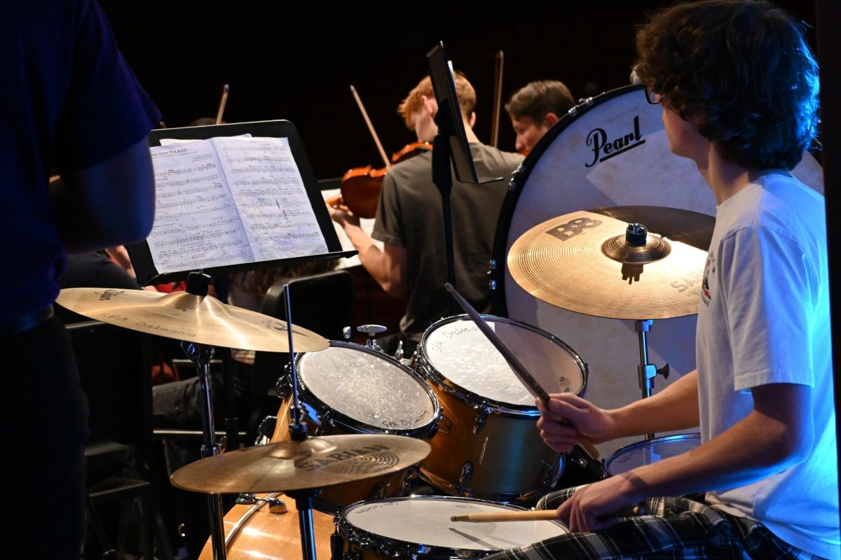 DRUMMER. During the performance of songs from Wicked, sophomore Nils Lajuzan plays the drums.