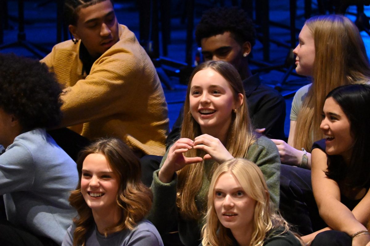 ALL LOVE. When she spotted her family in the audience, sophomore Eloise Mahoney put her hands together and signaled a heart to them.