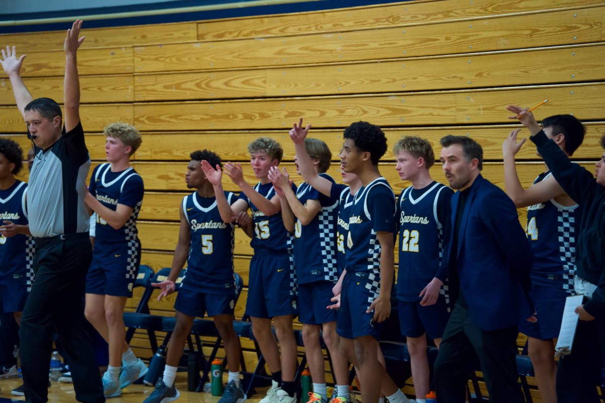 CHEER. The players celebrate one of their teammates after shooting a 3 pointer.