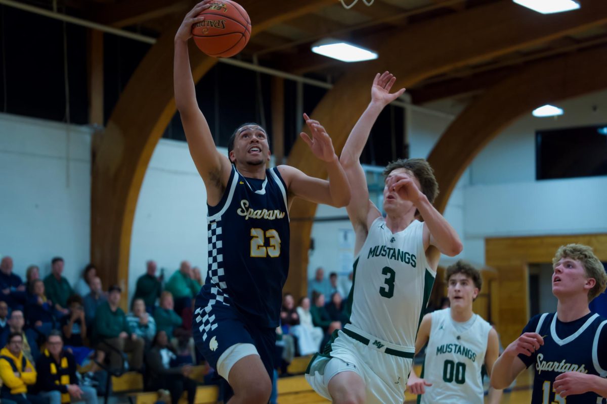 LAYUP. Cunningham goes up for the layup. Ending the game with the most points from the Spartans.